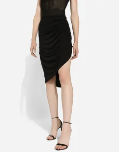 Asymmetrical jersey skirt with draping