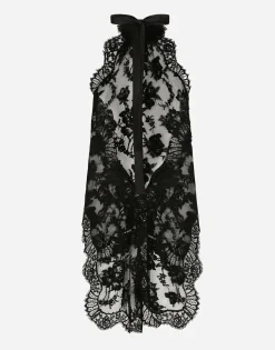 Asymmetrical lace top with flower detail on neck