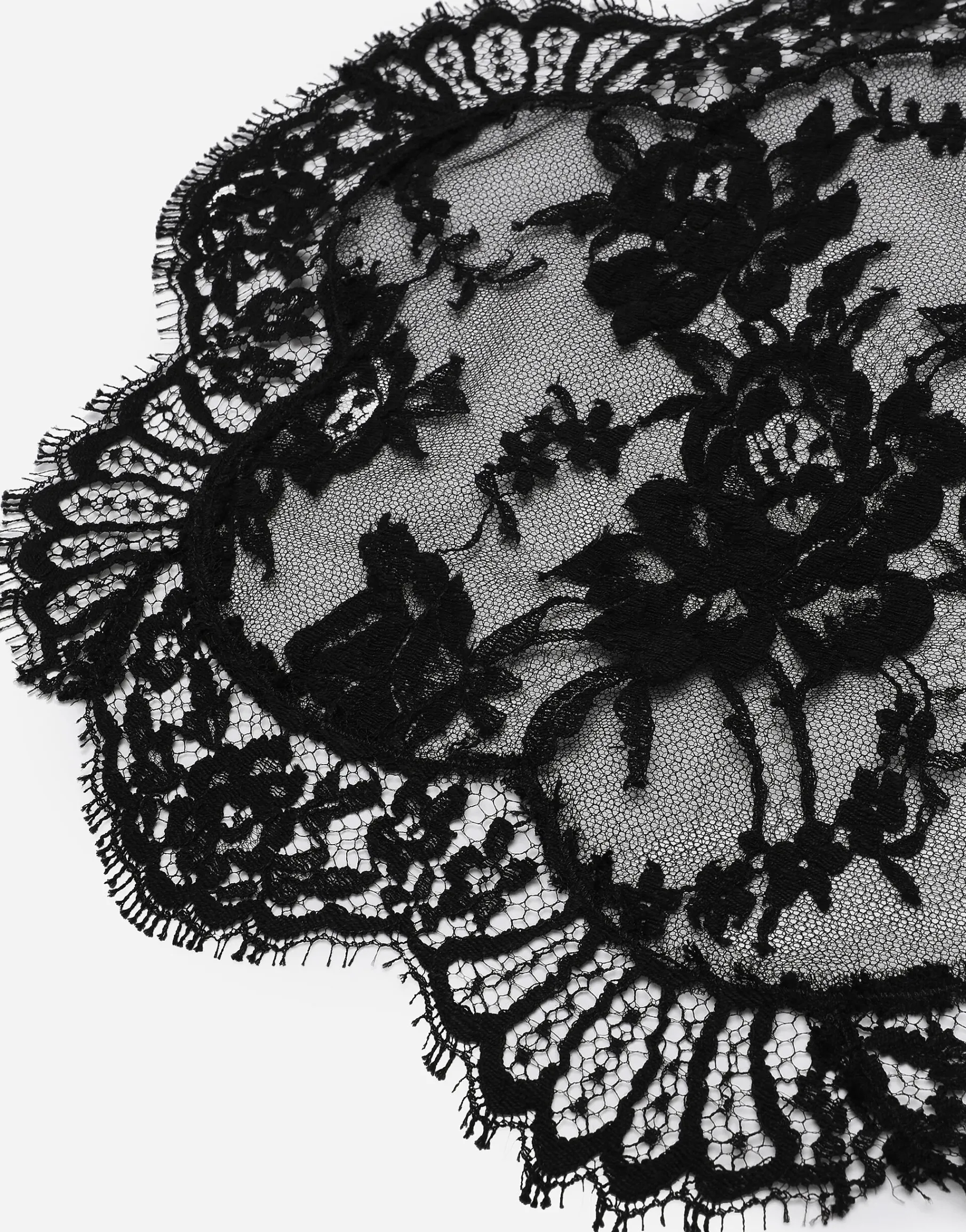 Asymmetrical lace top with flower detail on neck