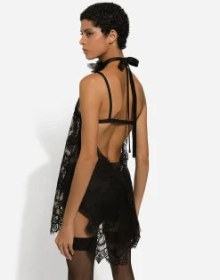 Asymmetrical lace top with flower detail on neck