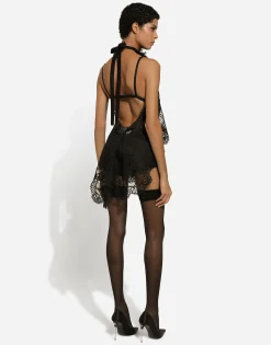 Asymmetrical lace top with flower detail on neck