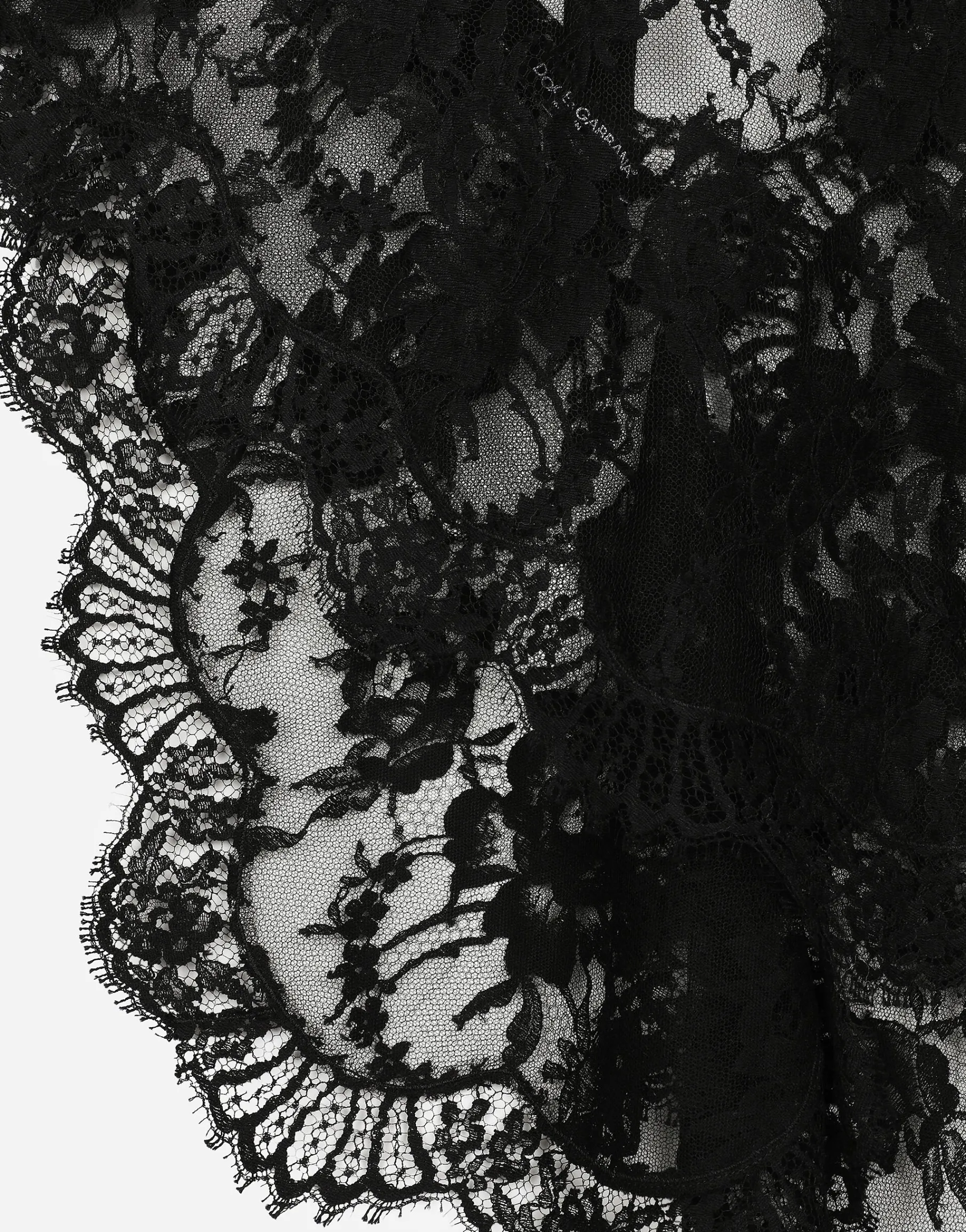 Asymmetrical lace top with flower detail on neck