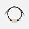 Bracelet with cord and logo tag