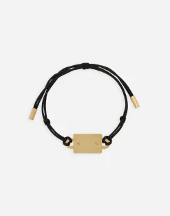 Bracelet with cord and logo tag