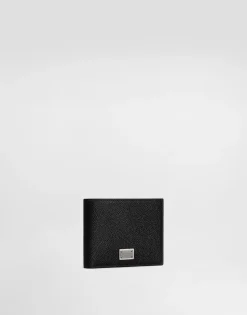 Calfskin wallet with coin pocket and logo tag