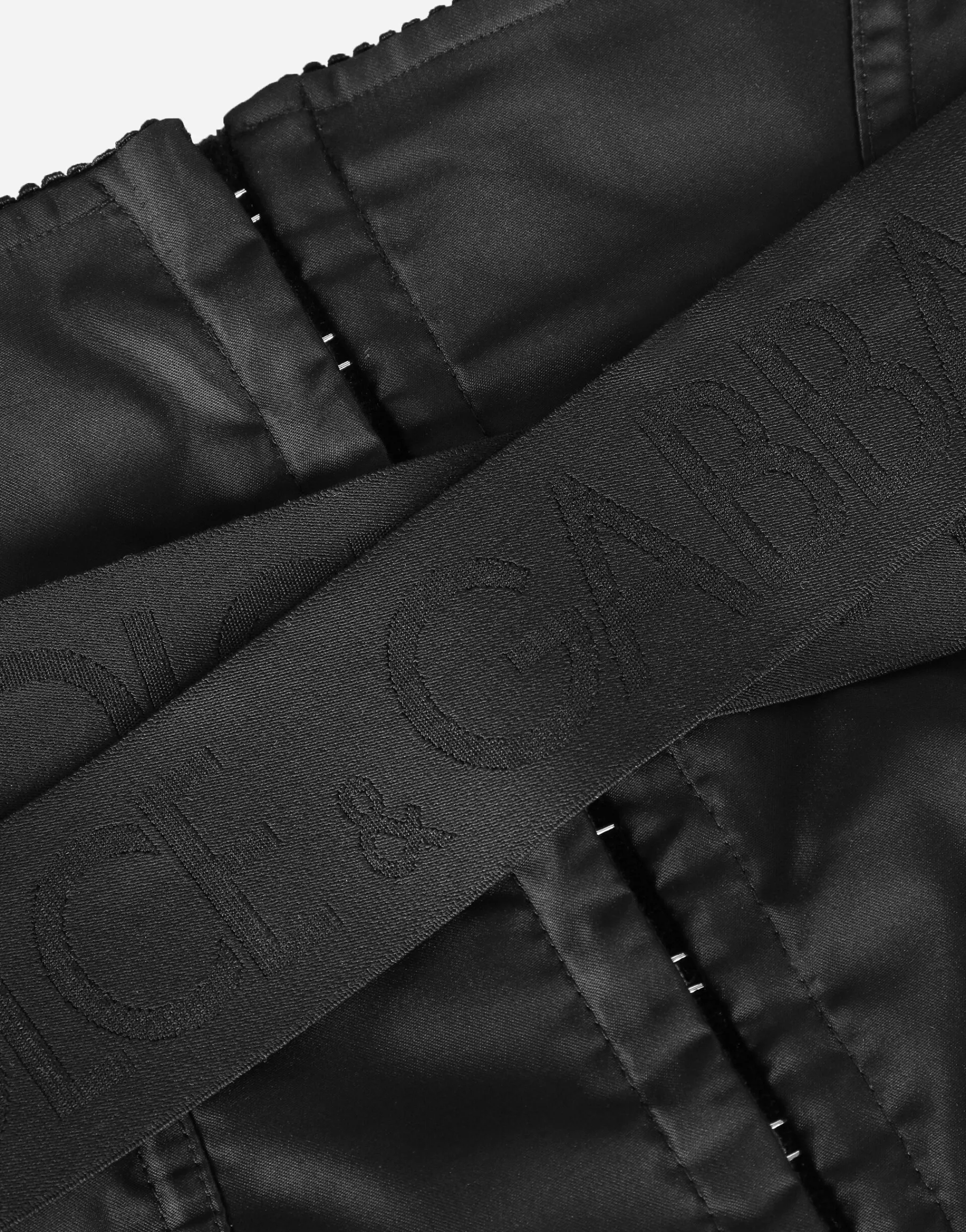 Corset-style belt with branded stretch crossover bands