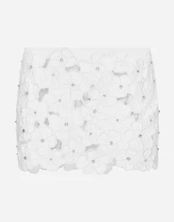Cotton miniskirt with floral embroidery and rhinestone embellishment