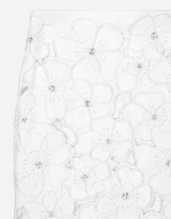 Cotton miniskirt with floral embroidery and rhinestone embellishment