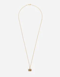 Crown yellow gold pendant with iron eye