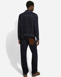 Denim jacket with embossed tag on leather