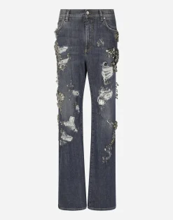 Denim jeans with ripped details and appliqués