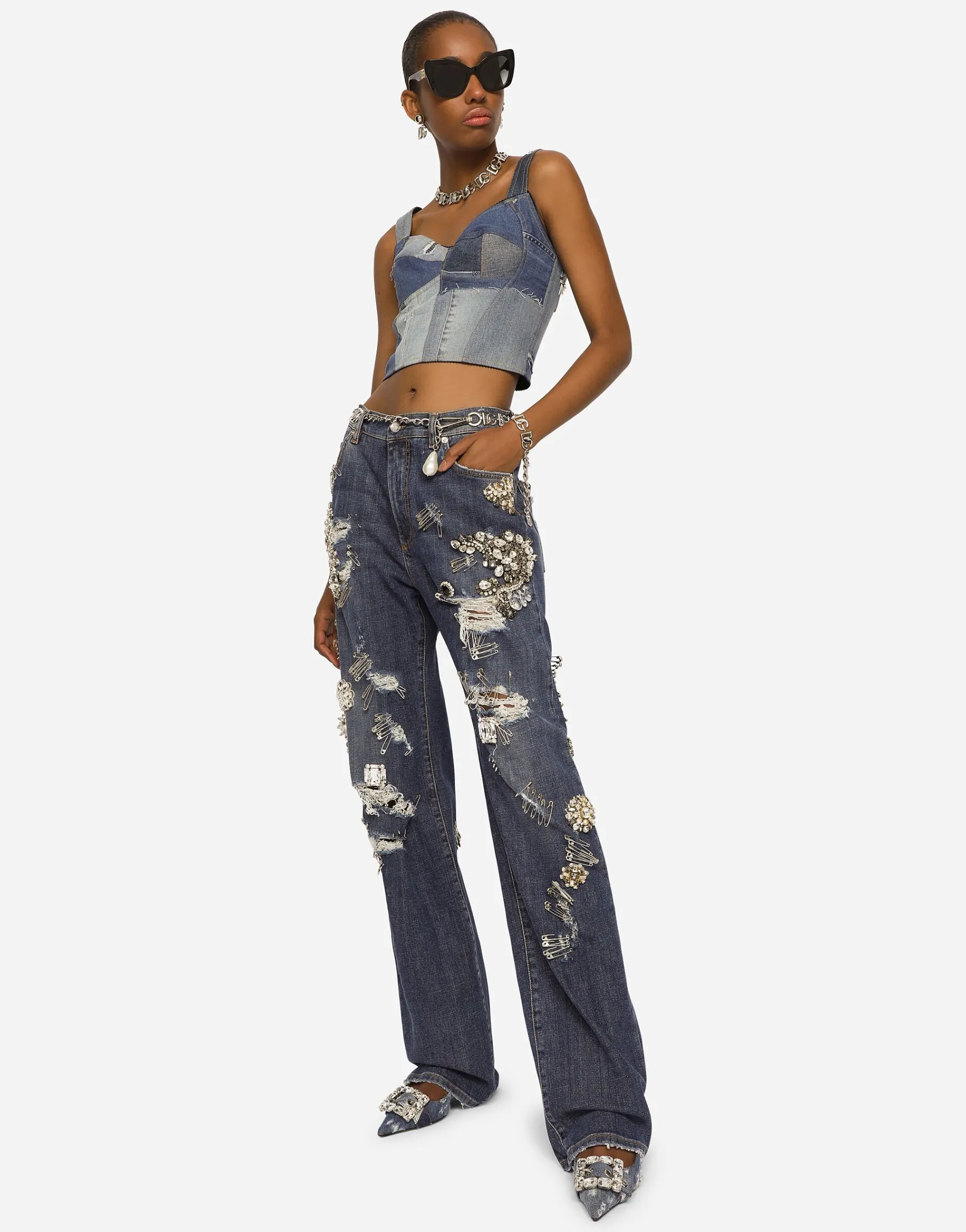 Denim jeans with ripped details and appliqués