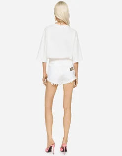 Denim shorts with ripped details and abrasions
