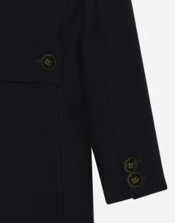 Double-breasted wool coat with branded buttons