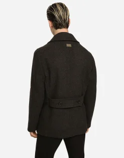 Double-breasted wool pea coat with branded tag