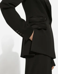 Double-breasted woolen jacket with side vents