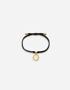 Fabric Devotion bracelet with yellow and white gold pendant charm with diamonds