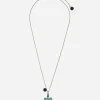 Family cross pendant with emeralds