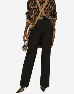 Flared wool pants with logo tag