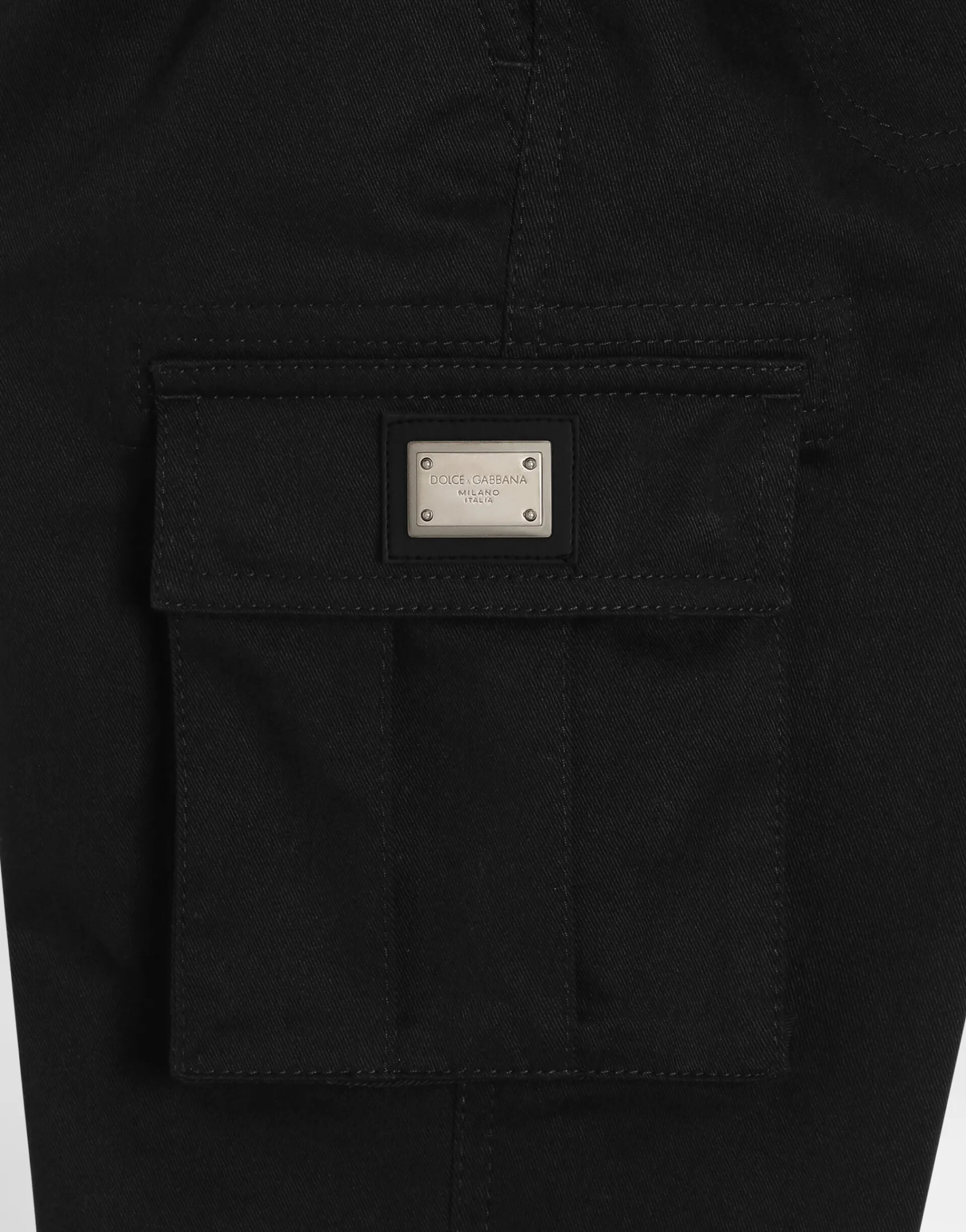 Gabardine cargo pants with branded metal tag
