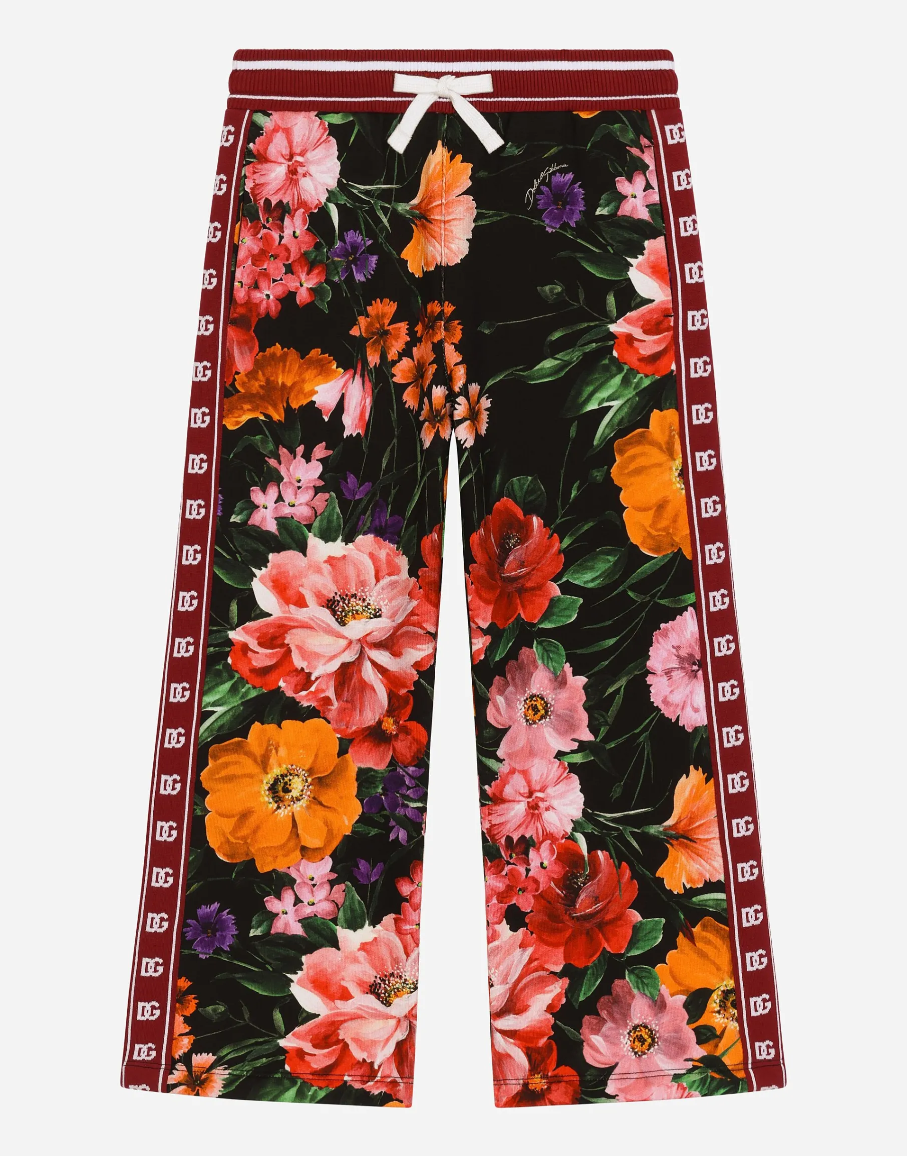 Jersey jogging pants with floral print over a black background