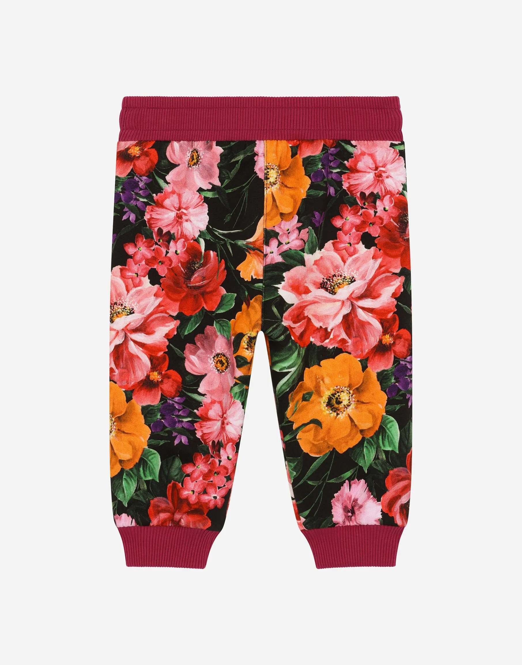 Jersey jogging pants with floral print over a black background