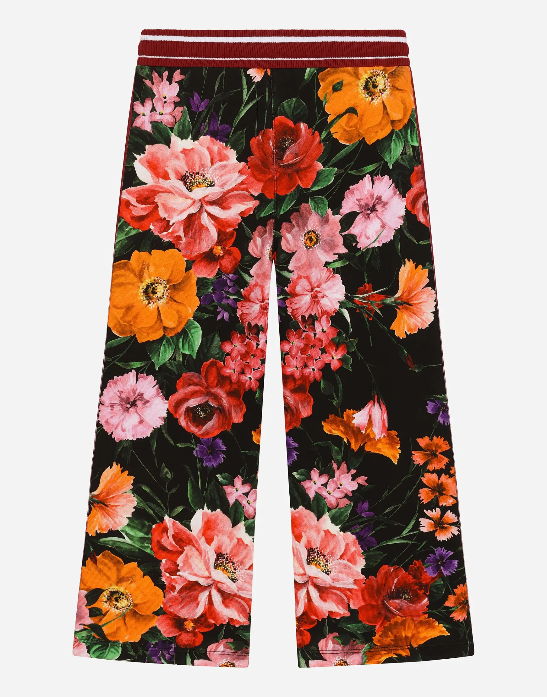 Jersey jogging pants with floral print over a black background