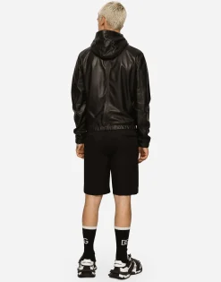 Leather jacket with hood and branded tag