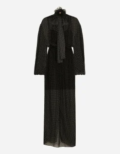 Long silk chiffon dress with polka-dot print, a pussy-bow detail and flower on neck