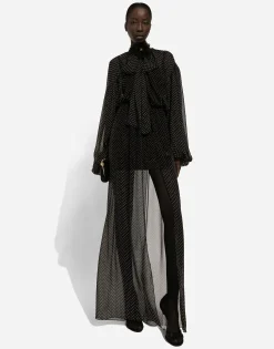 Long silk chiffon dress with polka-dot print, a pussy-bow detail and flower on neck