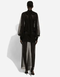 Long tulle dress with full sleeves and fusible rhinestone embellishment