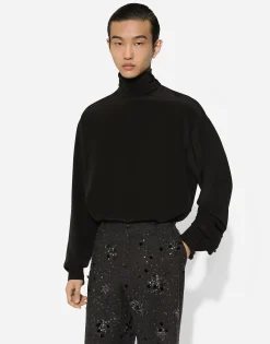 Loose silk turtleneck with shirt cuffs