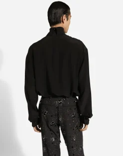 Loose silk turtleneck with shirt cuffs