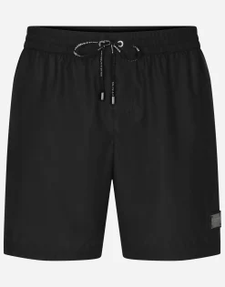 Mid-length swim trunks with branded plate