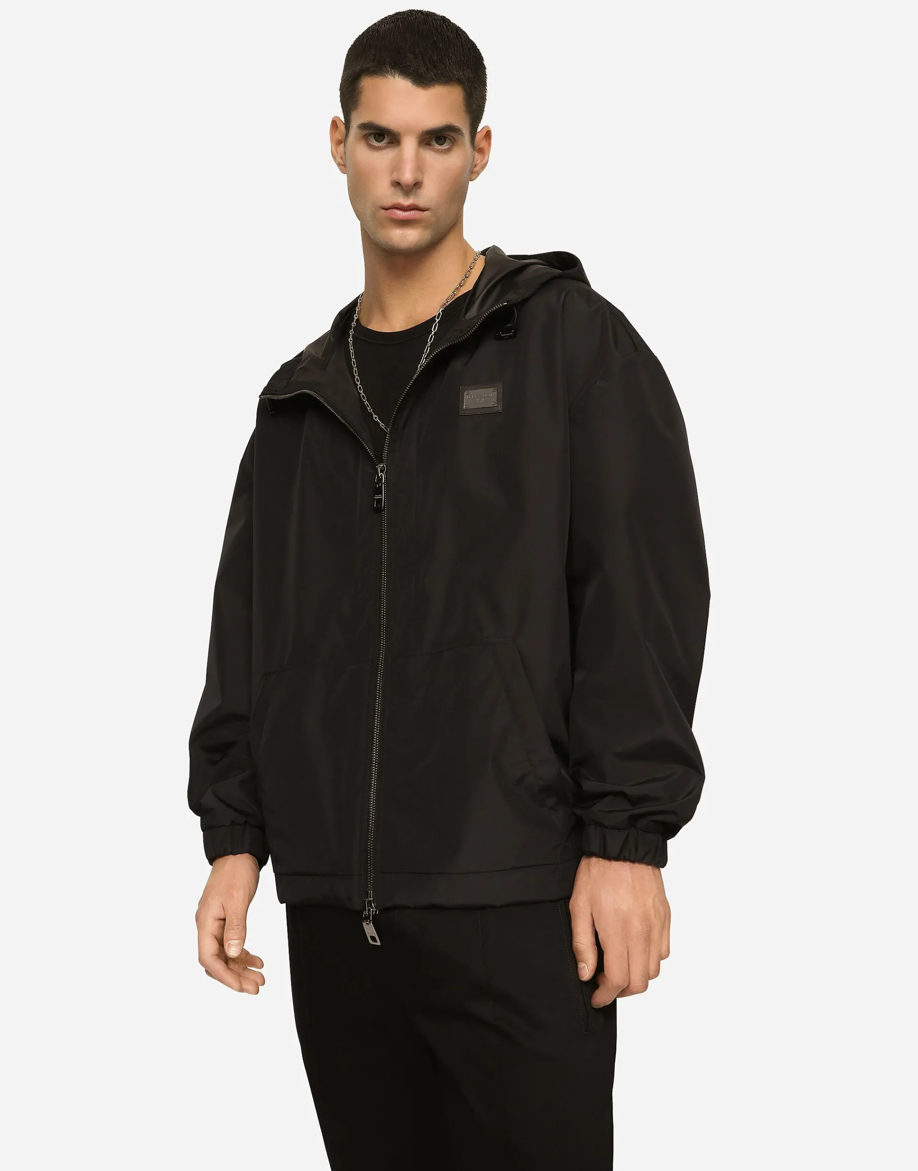 Nylon jacket with hood and branded tag