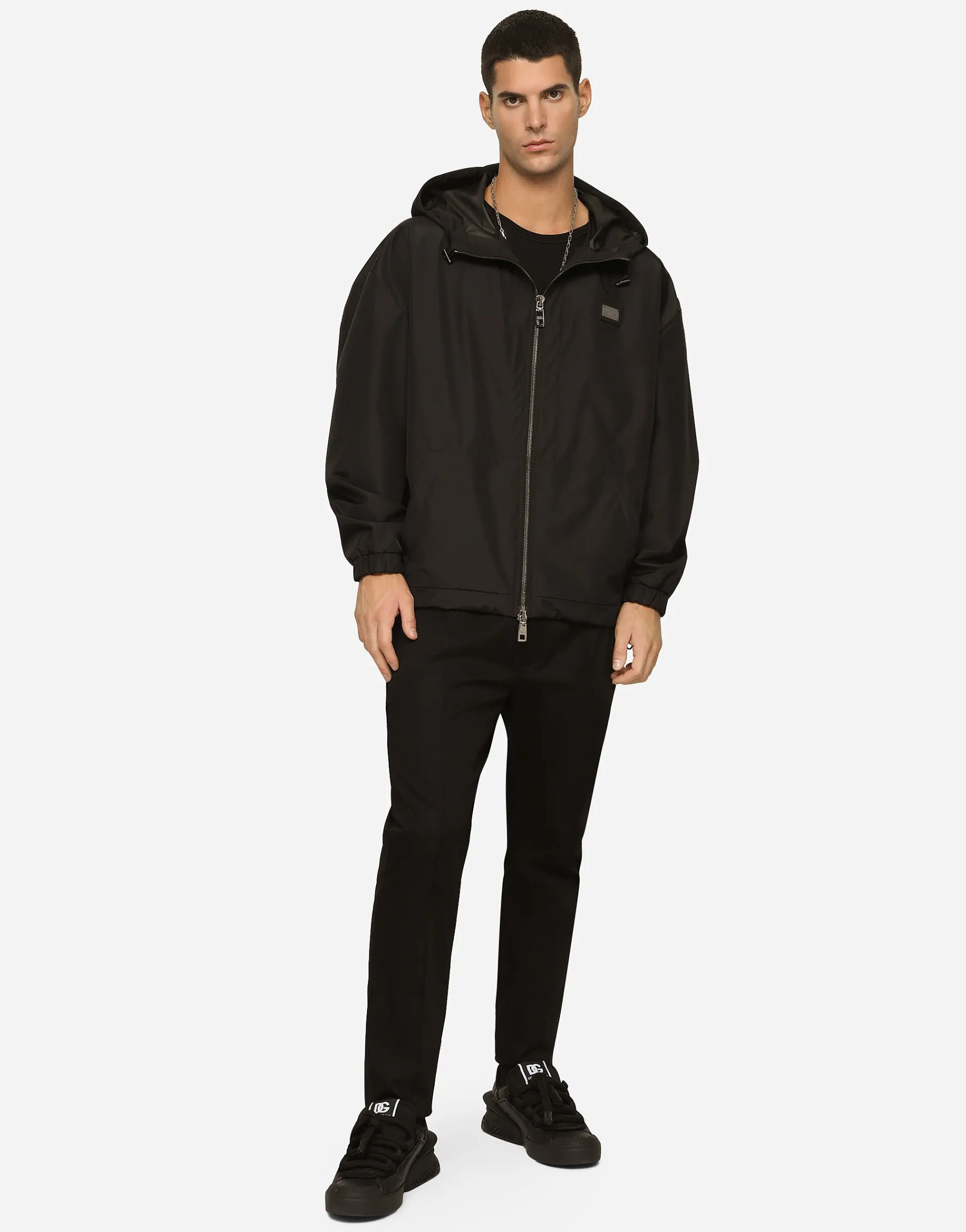 Nylon jacket with hood and branded tag