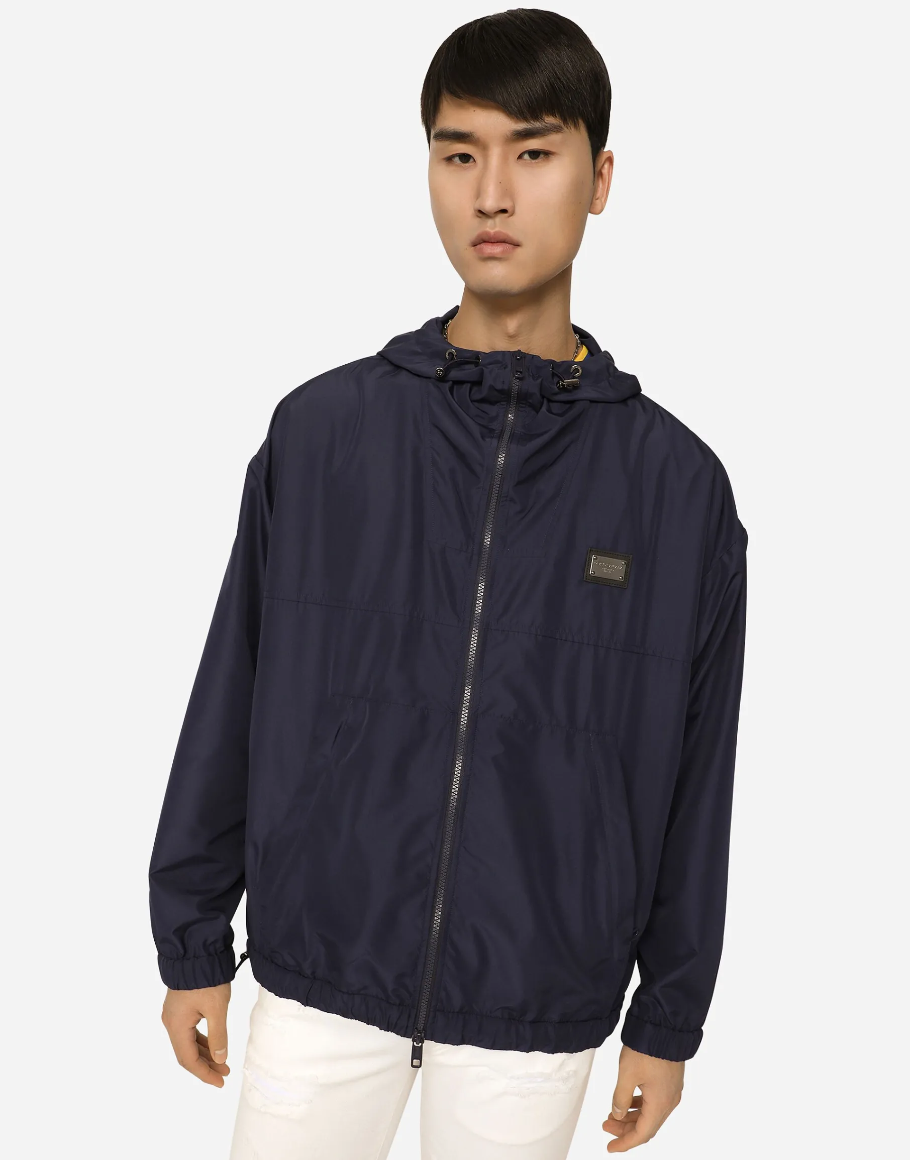 Nylon jacket with hood and branded tag