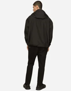 Nylon jacket with hood and branded tag