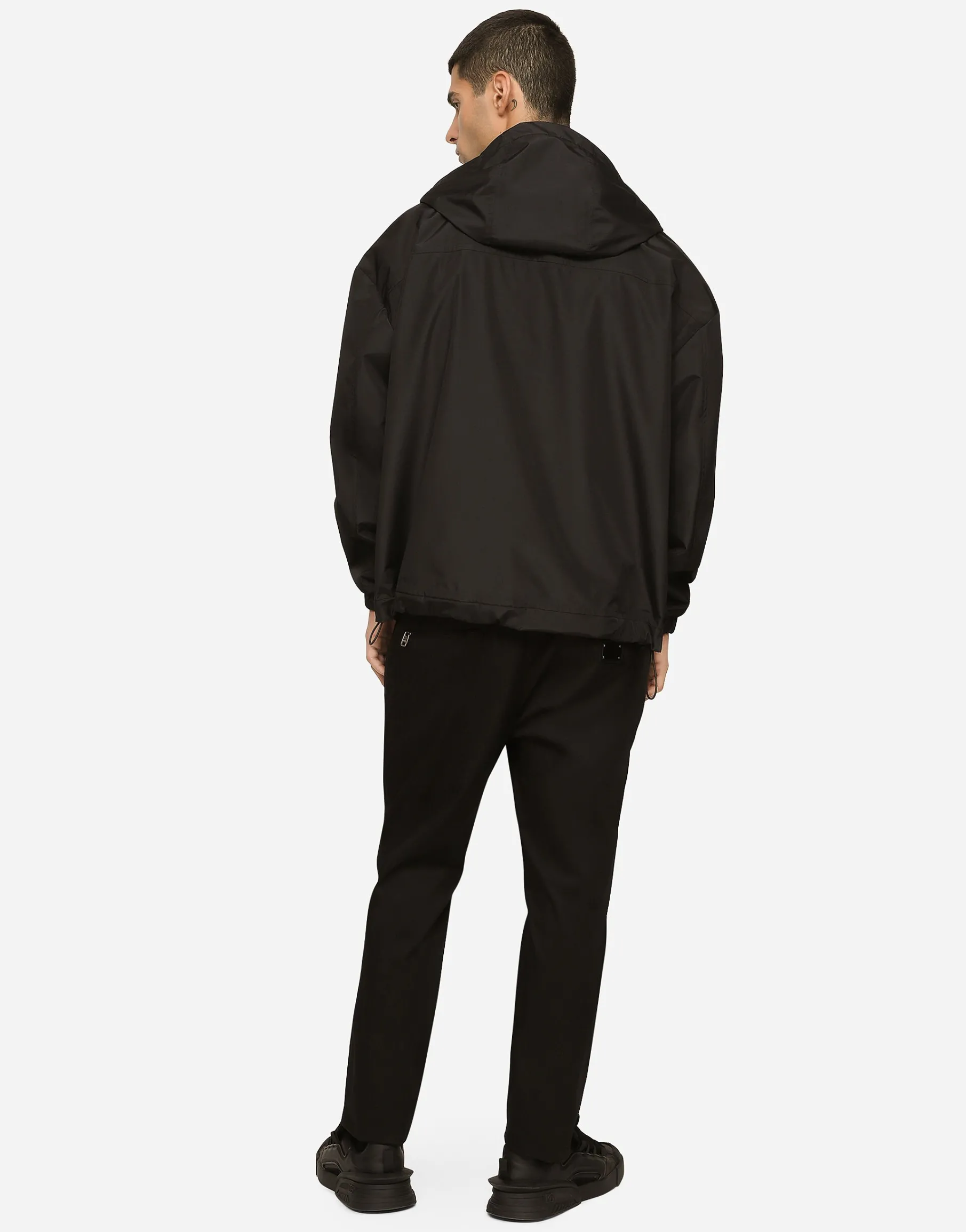Nylon jacket with hood and branded tag