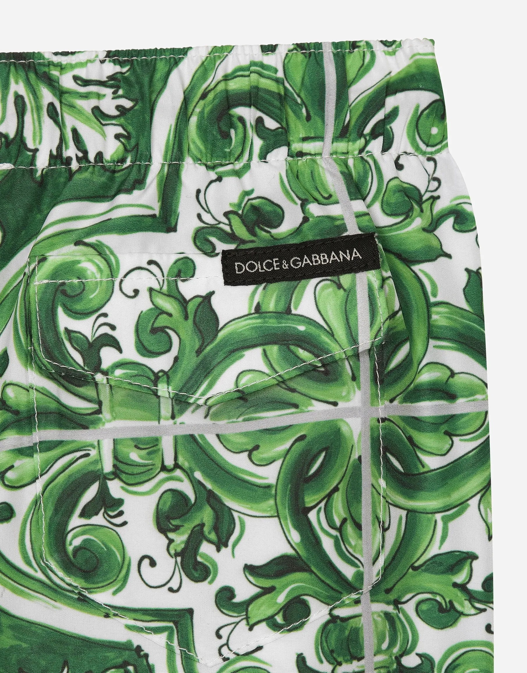 Nylon swim trunks with green majolica print
