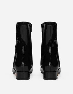Patent leather ankle boots with branded heel