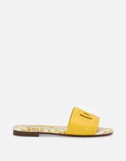 Patent leather sliders with yellow majolica print and cut-out DG detail