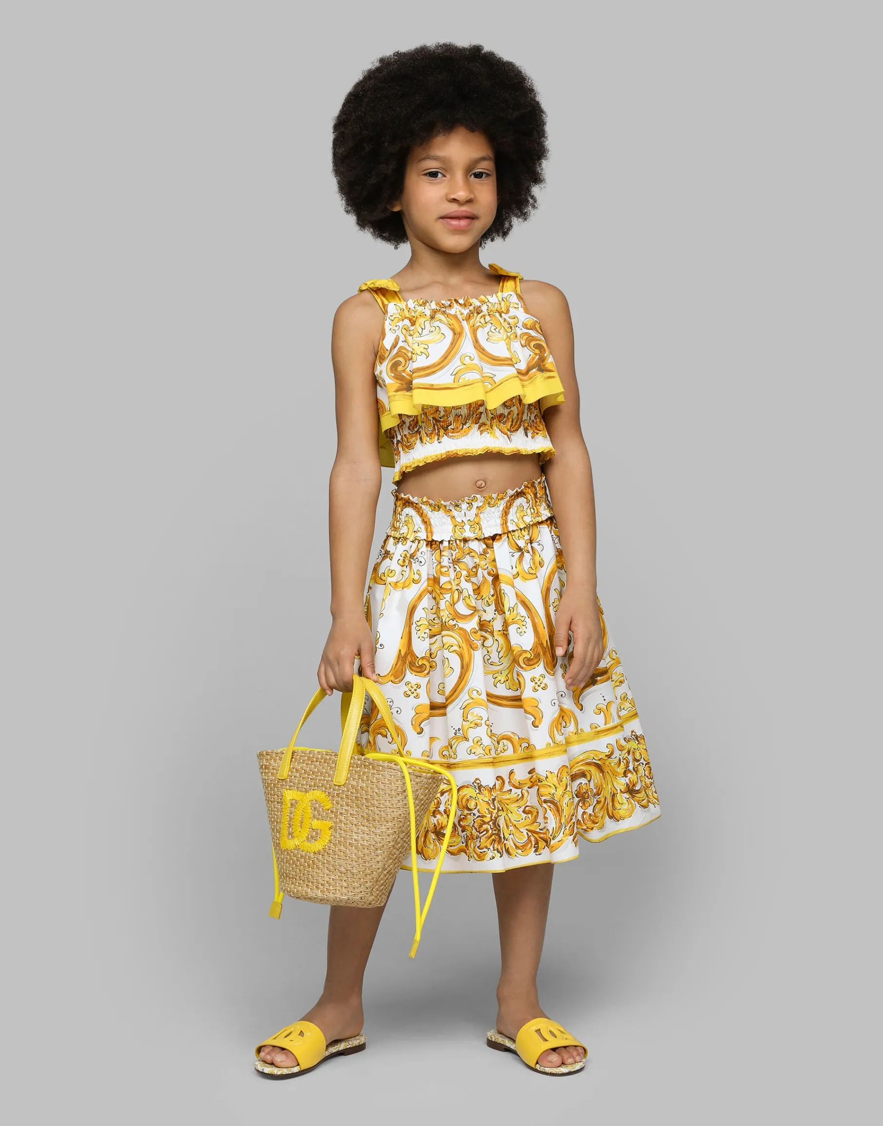 Patent leather sliders with yellow majolica print and cut-out DG detail