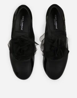 Patent leather slippers with flower appliqué