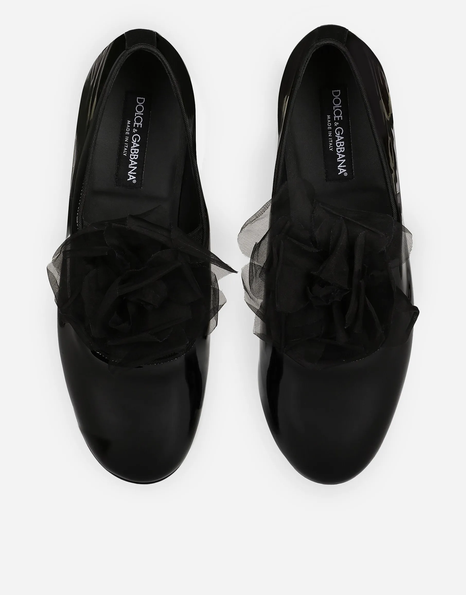 Patent leather slippers with flower appliqué