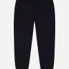 Plain knit jogging pants with logo tag