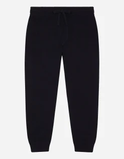 Plain knit jogging pants with logo tag