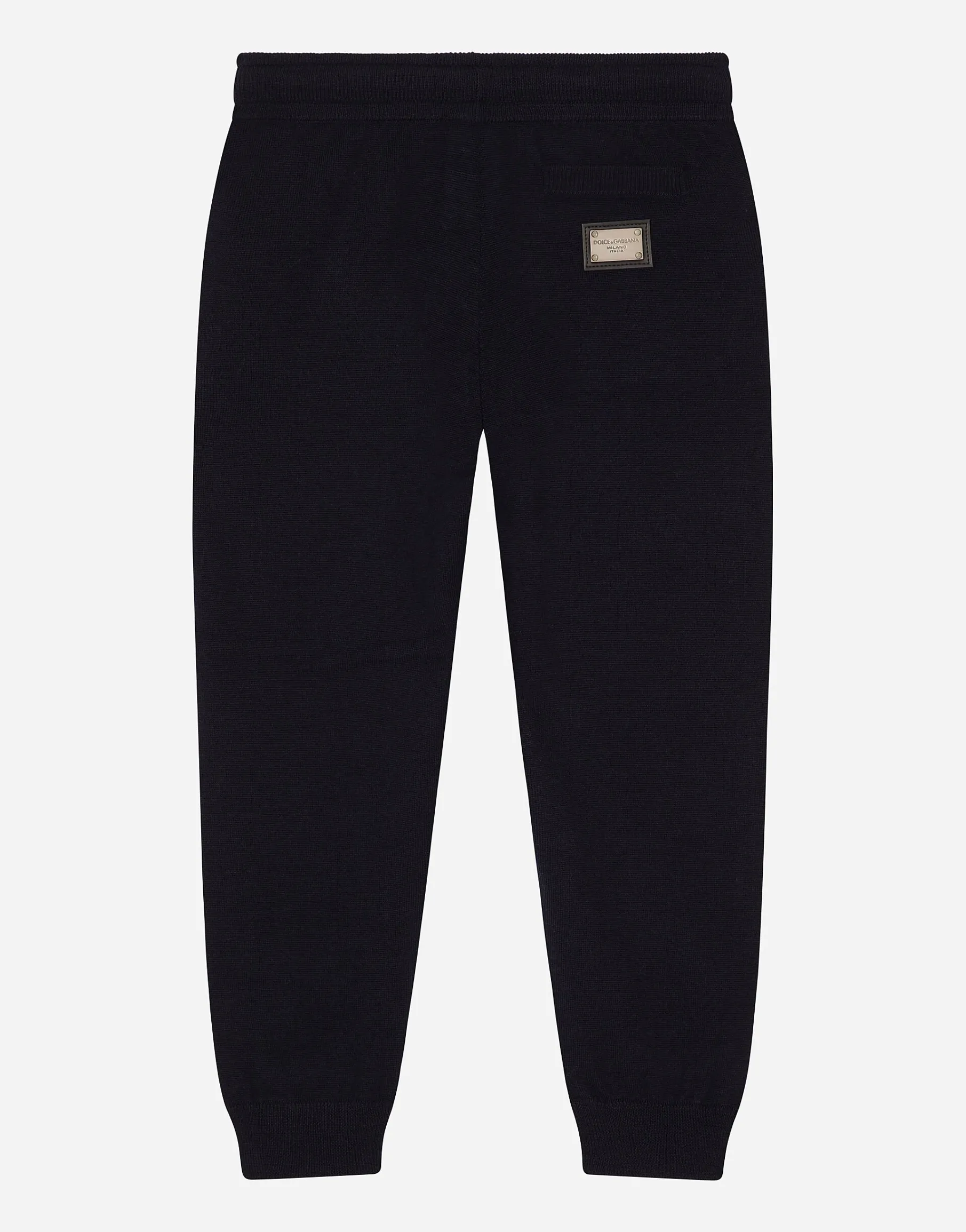 Plain knit jogging pants with logo tag