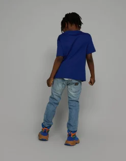 5-pocket treated stretch denim jeans with logo print
