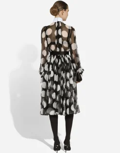 Polka-dot chiffon calf-length dress with piqué details